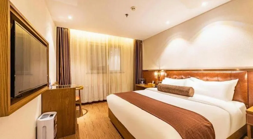 Bed in James Joyce Coffetel Shijiazhuang the Mixc Jinyuan Tower Airport Bus