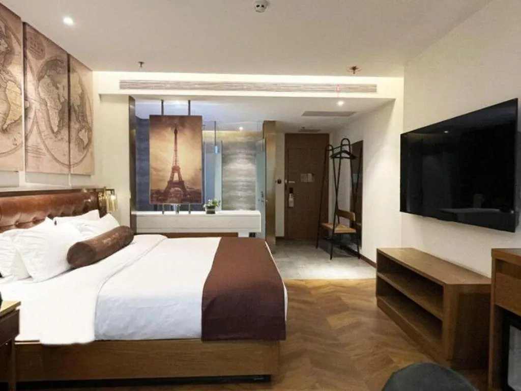 Bed in James Joyce Coffetel Shijiazhuang the Mixc Jinyuan Tower Airport Bus