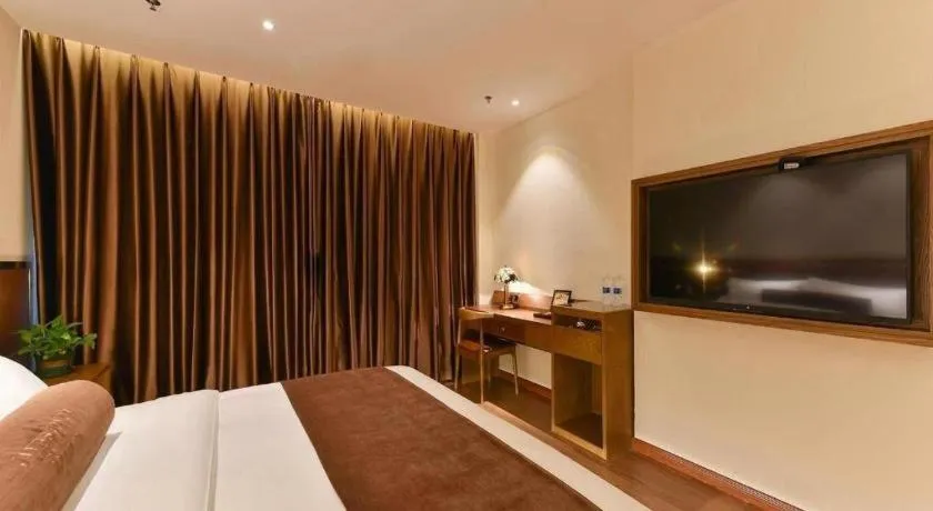 Bed in James Joyce Coffetel Shijiazhuang the Mixc Jinyuan Tower Airport Bus