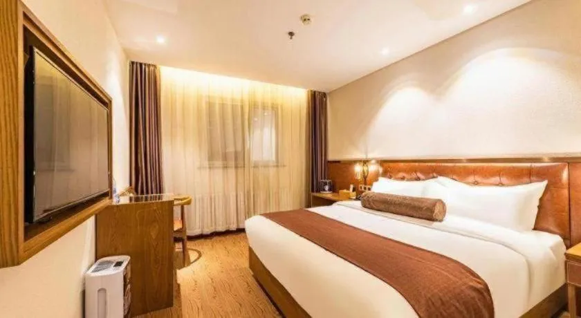 Bed in James Joyce Coffetel Shijiazhuang the Mixc Jinyuan Tower Airport Bus