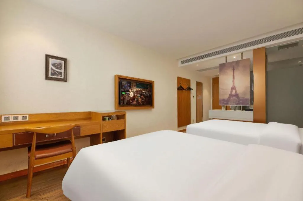 Bed in James Joyce Coffetel Shijiazhuang the Mixc Jinyuan Tower Airport Bus