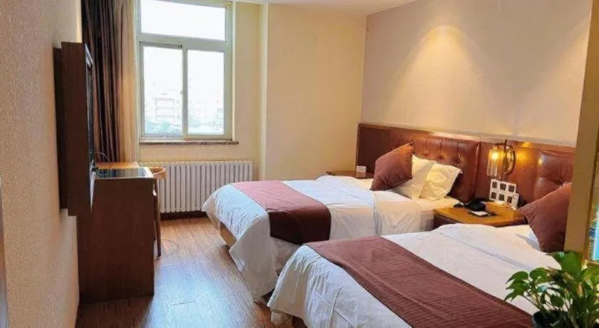 Bed in James Joyce Coffetel Shijiazhuang the Mixc Jinyuan Tower Airport Bus