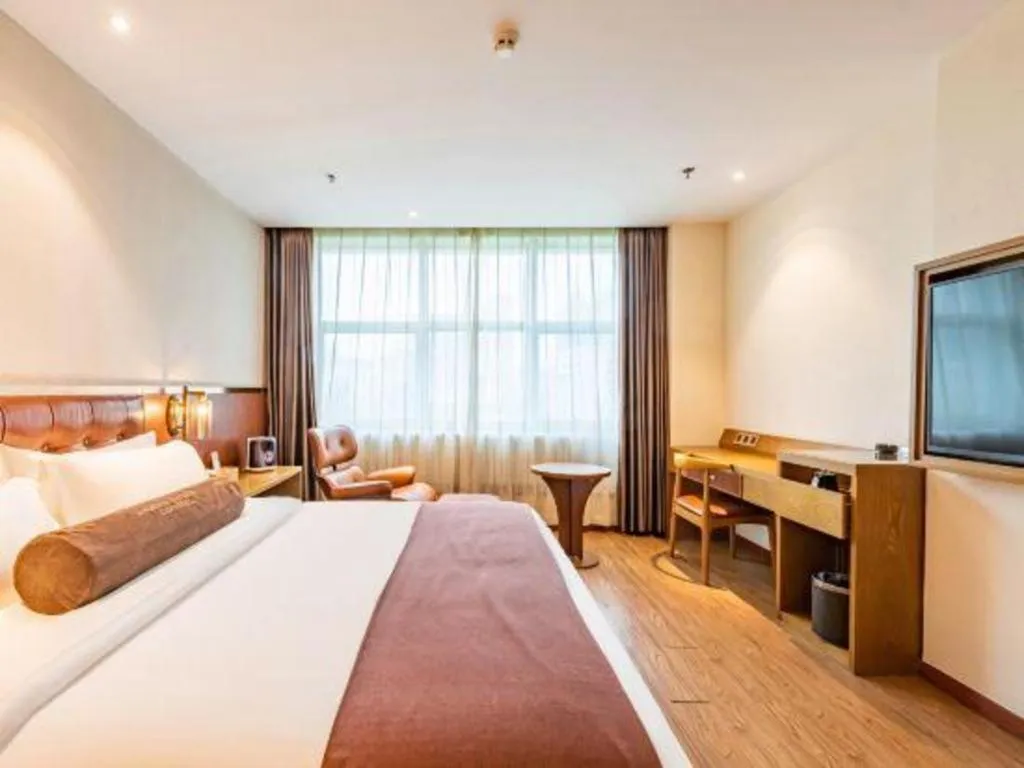 Bed in James Joyce Coffetel Shijiazhuang the Mixc Jinyuan Tower Airport Bus