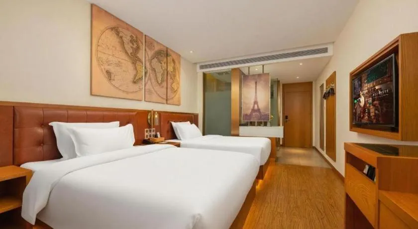 Bed in James Joyce Coffetel Shijiazhuang the Mixc Jinyuan Tower Airport Bus