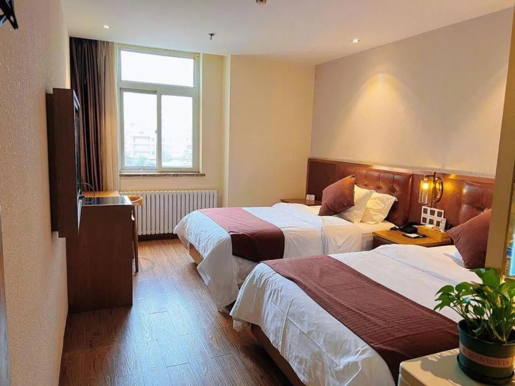 Bed in James Joyce Coffetel Shijiazhuang the Mixc Jinyuan Tower Airport Bus