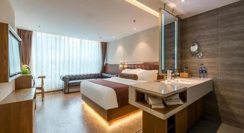 Bed in James Joyce Coffetel Shijiazhuang the Mixc Jinyuan Tower Airport Bus