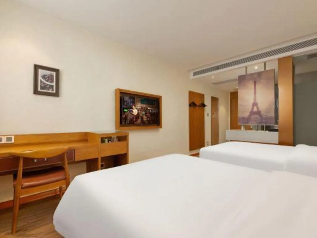 Bed in James Joyce Coffetel Shijiazhuang the Mixc Jinyuan Tower Airport Bus
