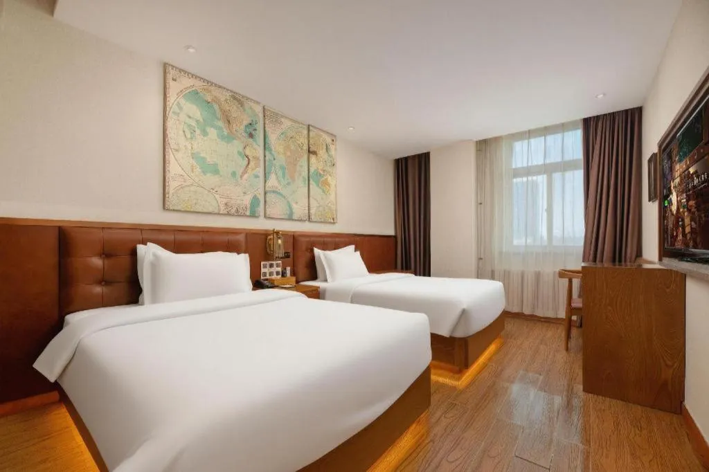 Bed in James Joyce Coffetel Shijiazhuang the Mixc Jinyuan Tower Airport Bus