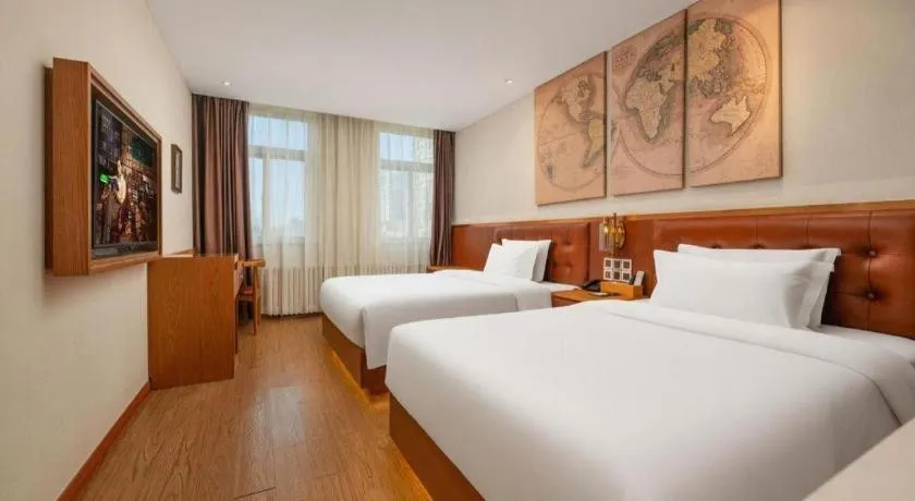 Bed in James Joyce Coffetel Shijiazhuang the Mixc Jinyuan Tower Airport Bus