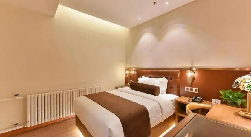 Bed in James Joyce Coffetel Shijiazhuang the Mixc Jinyuan Tower Airport Bus