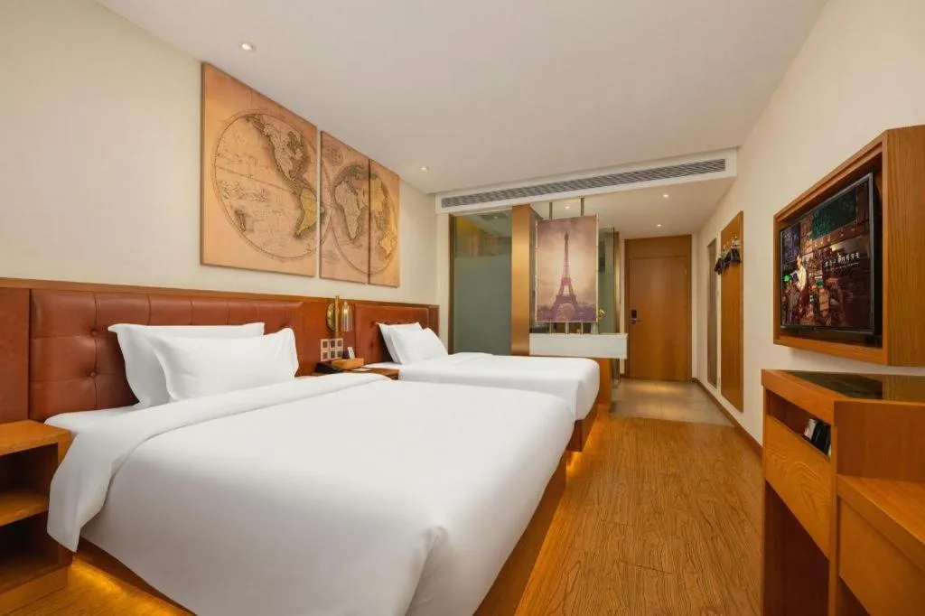 Bed in James Joyce Coffetel Shijiazhuang the Mixc Jinyuan Tower Airport Bus