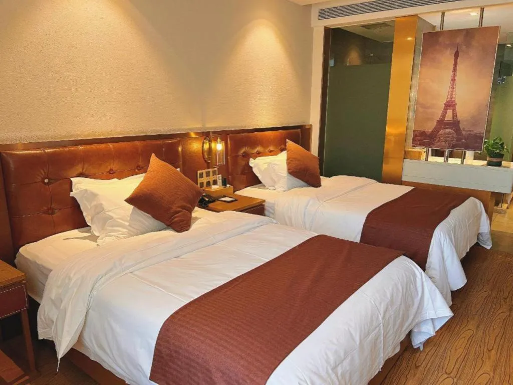 Bed in James Joyce Coffetel Shijiazhuang the Mixc Jinyuan Tower Airport Bus