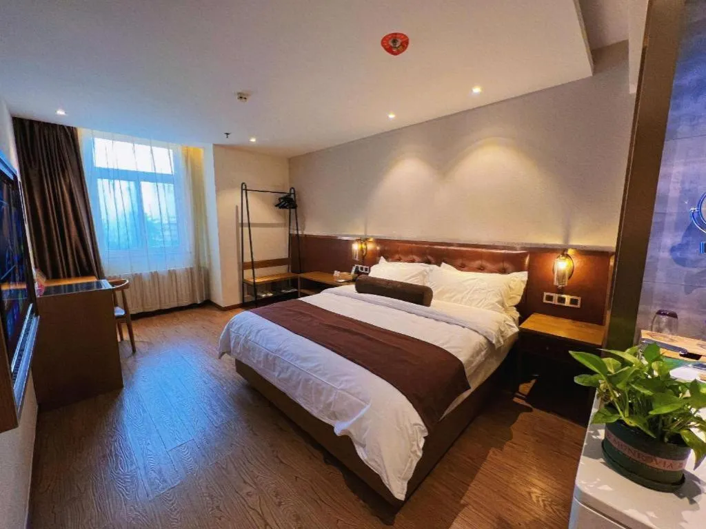 Bed in James Joyce Coffetel Shijiazhuang the Mixc Jinyuan Tower Airport Bus