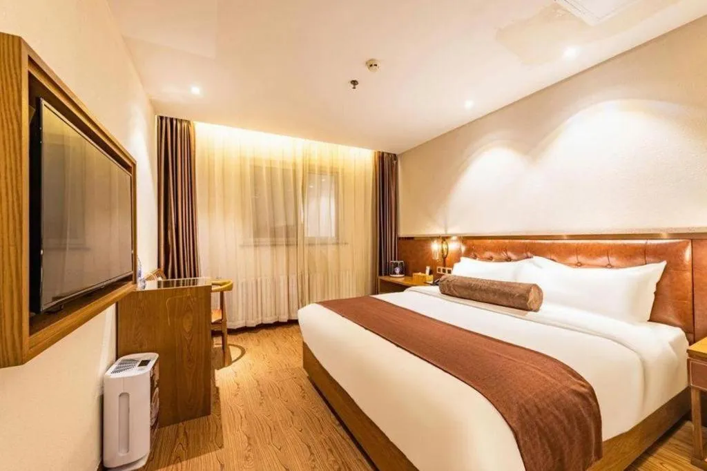 Bed in James Joyce Coffetel Shijiazhuang the Mixc Jinyuan Tower Airport Bus