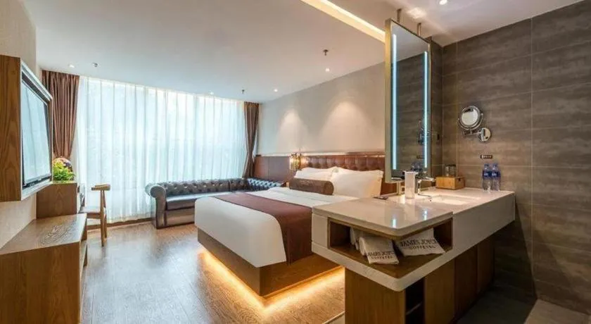 Bed in James Joyce Coffetel Shijiazhuang the Mixc Jinyuan Tower Airport Bus