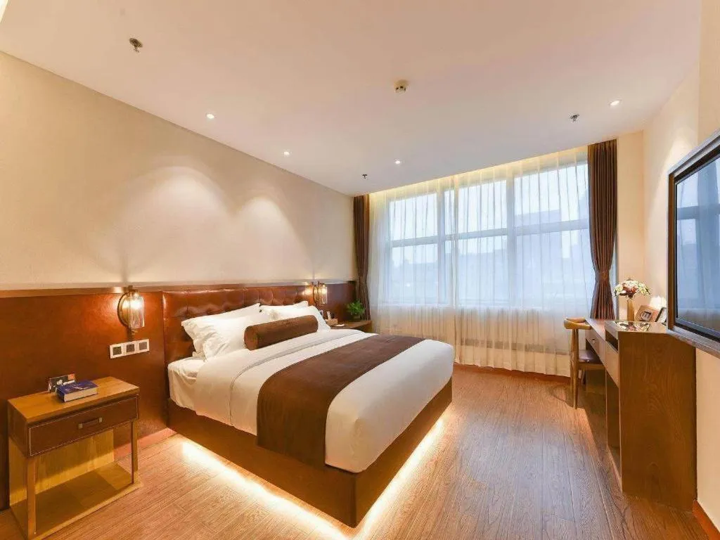 Bed in James Joyce Coffetel Shijiazhuang the Mixc Jinyuan Tower Airport Bus