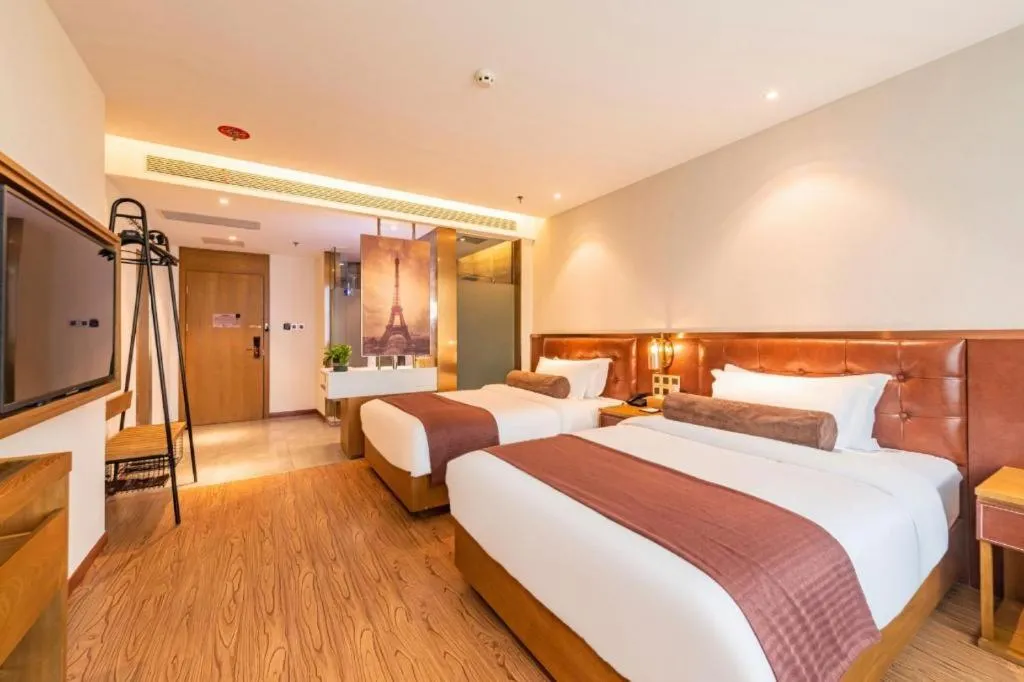 Bed in James Joyce Coffetel Shijiazhuang the Mixc Jinyuan Tower Airport Bus