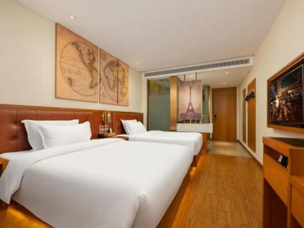 Bed in James Joyce Coffetel Shijiazhuang the Mixc Jinyuan Tower Airport Bus