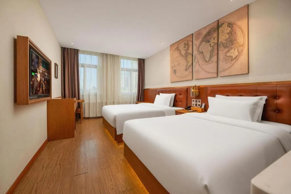 Bed in James Joyce Coffetel Shijiazhuang the Mixc Jinyuan Tower Airport Bus