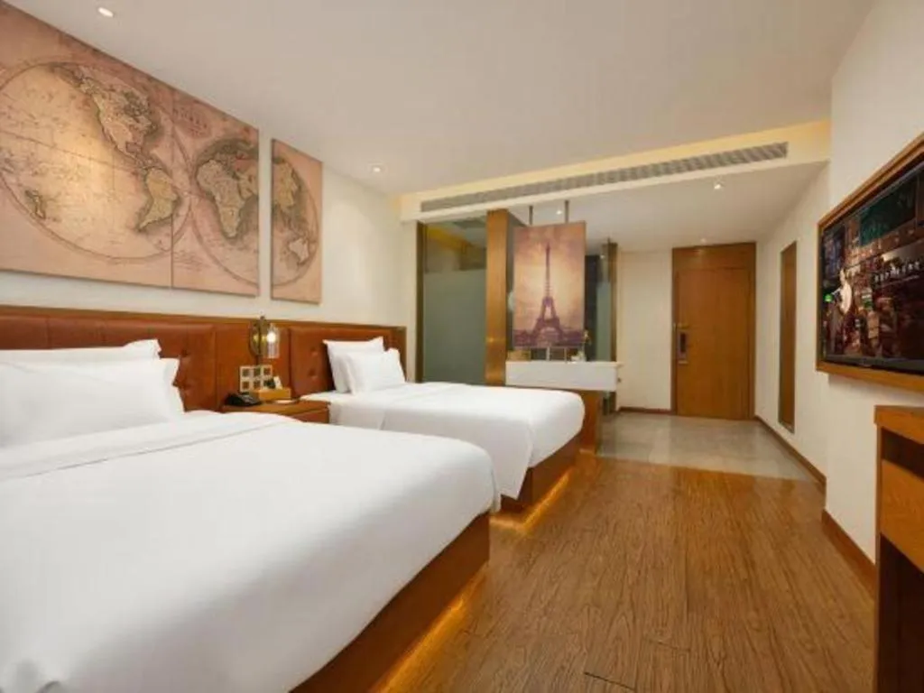 Bed in James Joyce Coffetel Shijiazhuang the Mixc Jinyuan Tower Airport Bus