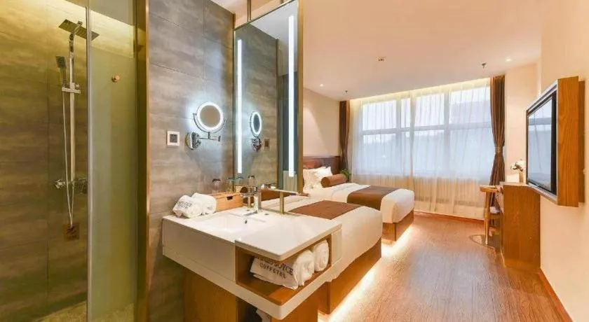 Bed in James Joyce Coffetel Shijiazhuang the Mixc Jinyuan Tower Airport Bus
