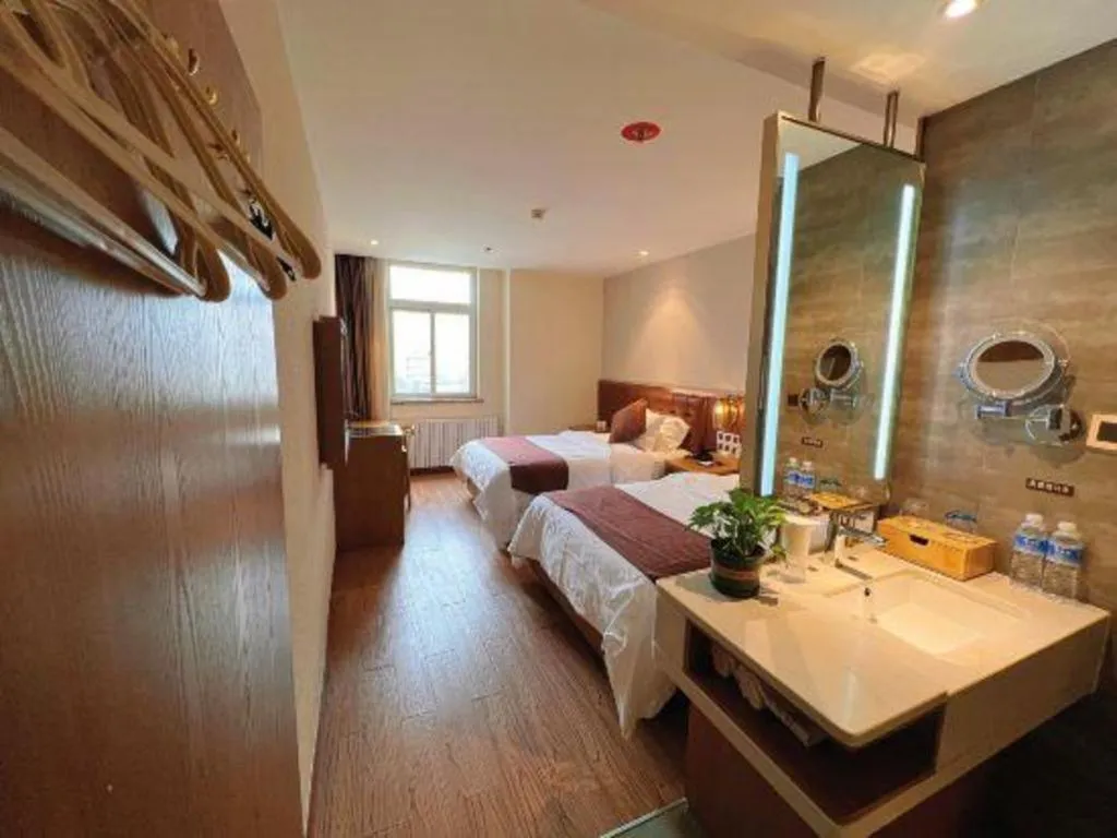 Bed in James Joyce Coffetel Shijiazhuang the Mixc Jinyuan Tower Airport Bus