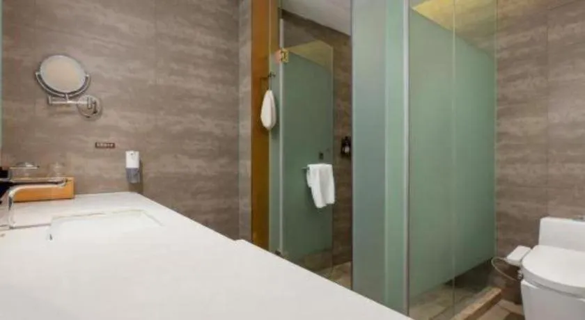 Bed in James Joyce Coffetel Shijiazhuang the Mixc Jinyuan Tower Airport Bus