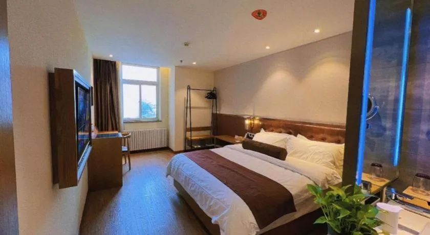 Bed in James Joyce Coffetel Shijiazhuang the Mixc Jinyuan Tower Airport Bus