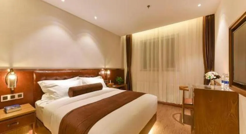 Bed in James Joyce Coffetel Shijiazhuang the Mixc Jinyuan Tower Airport Bus