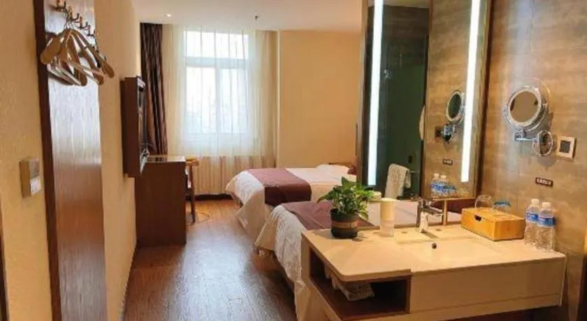 Bed in James Joyce Coffetel Shijiazhuang the Mixc Jinyuan Tower Airport Bus