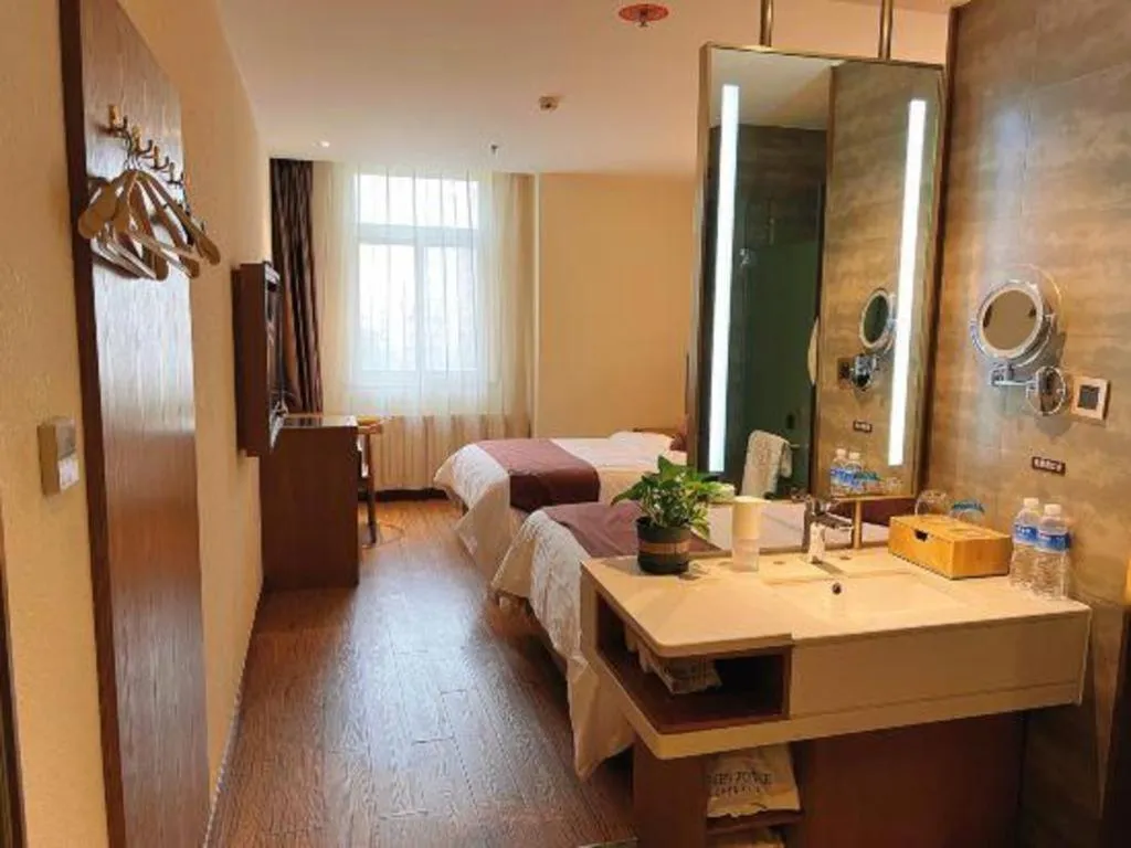 Bed in James Joyce Coffetel Shijiazhuang the Mixc Jinyuan Tower Airport Bus