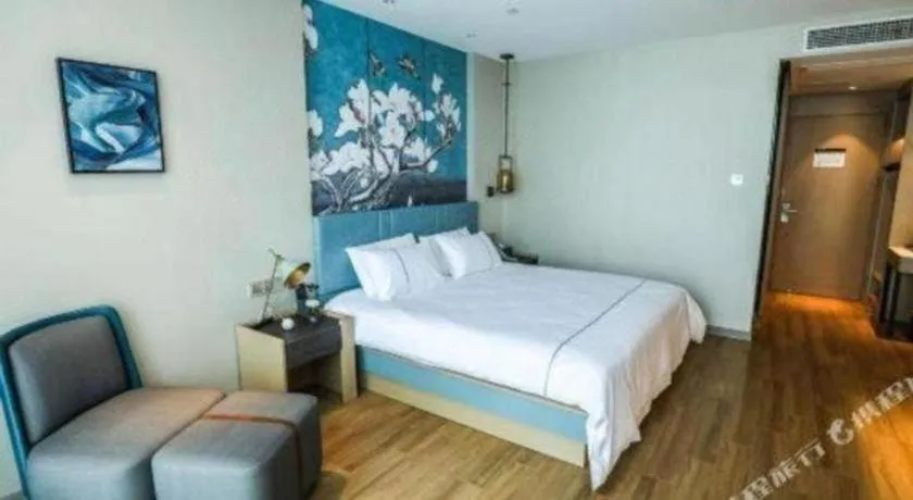 Bed in Magnotel Tongxiang Shimao Center