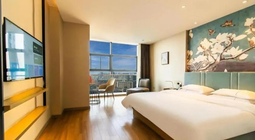 Bed in Magnotel Tongxiang Shimao Center