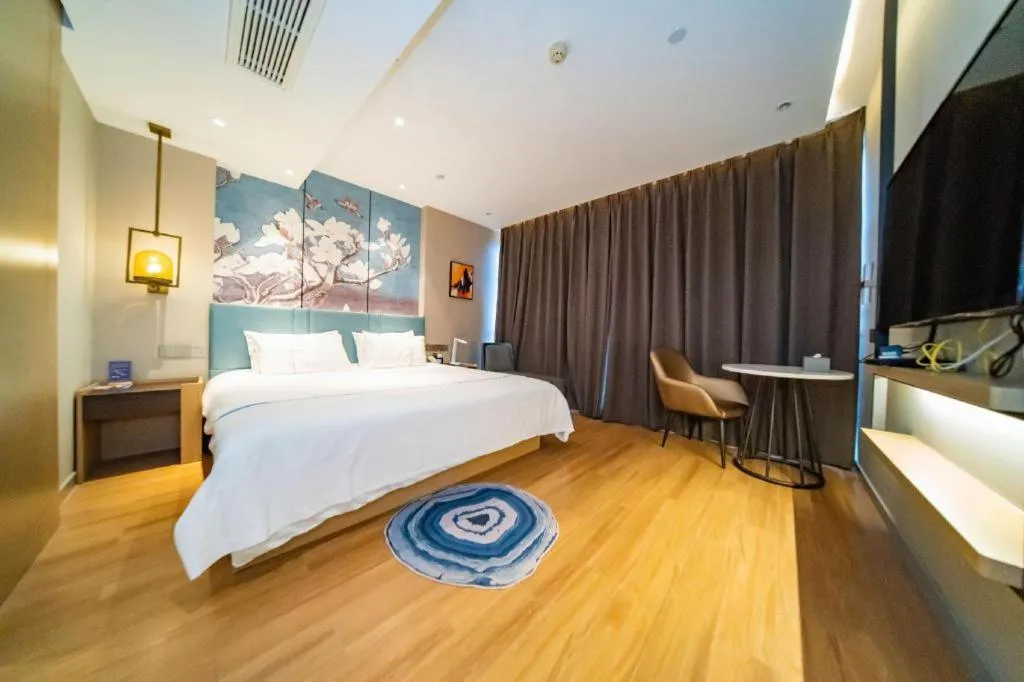 Bed in Magnotel Tongxiang Shimao Center