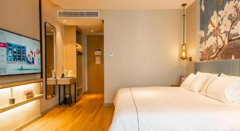 Bed in Magnotel Tongxiang Shimao Center