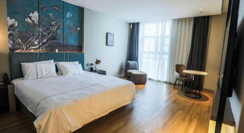 Bed in Magnotel Tongxiang Shimao Center