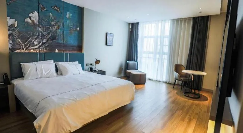 Bed in Magnotel Tongxiang Shimao Center