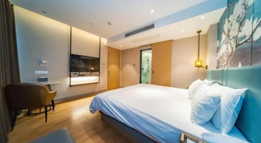 Bed in Magnotel Tongxiang Shimao Center