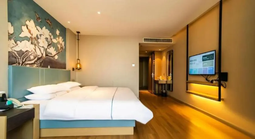 Bed in Magnotel Tongxiang Shimao Center