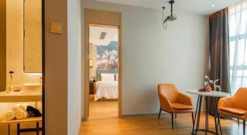 Bed in Magnotel Tongxiang Shimao Center