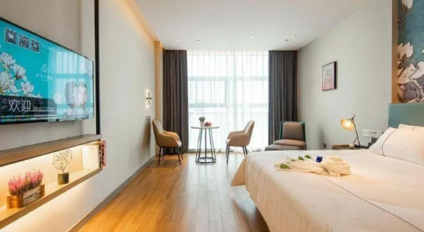 Bed in Magnotel Tongxiang Shimao Center