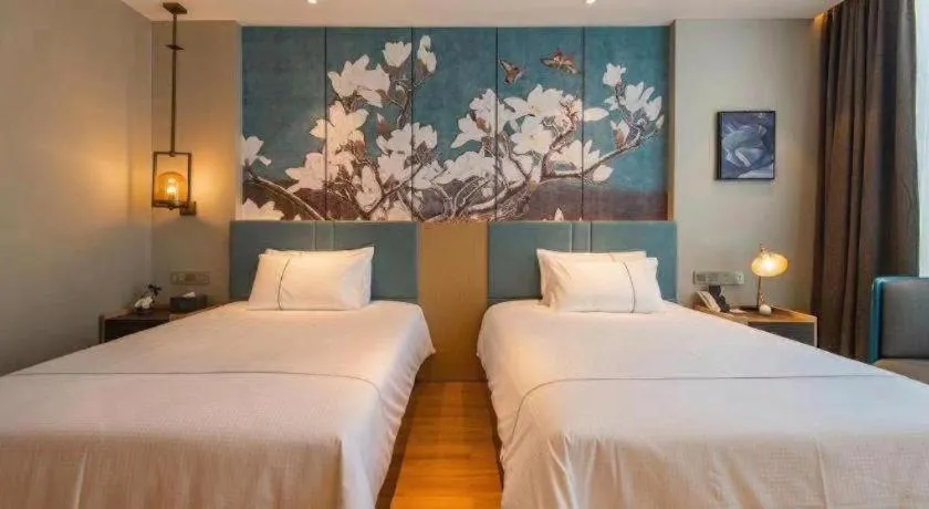 Bed in Magnotel Tongxiang Shimao Center