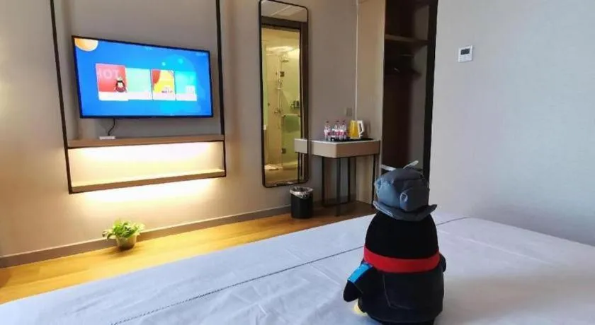 Bed in Magnotel Tongxiang Shimao Center