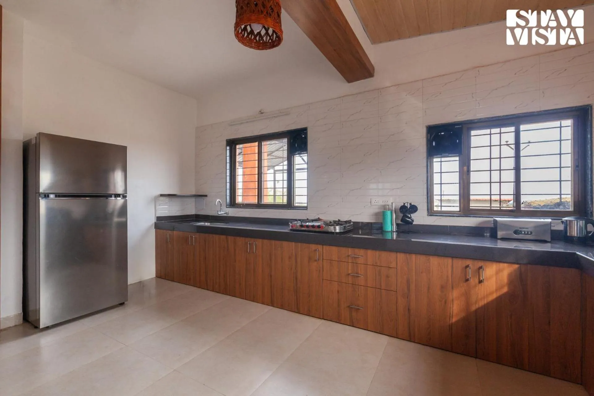 Kitchen or kitchenette in StayVista at Mangifera Agro Estate with Pool, Wi-Fi