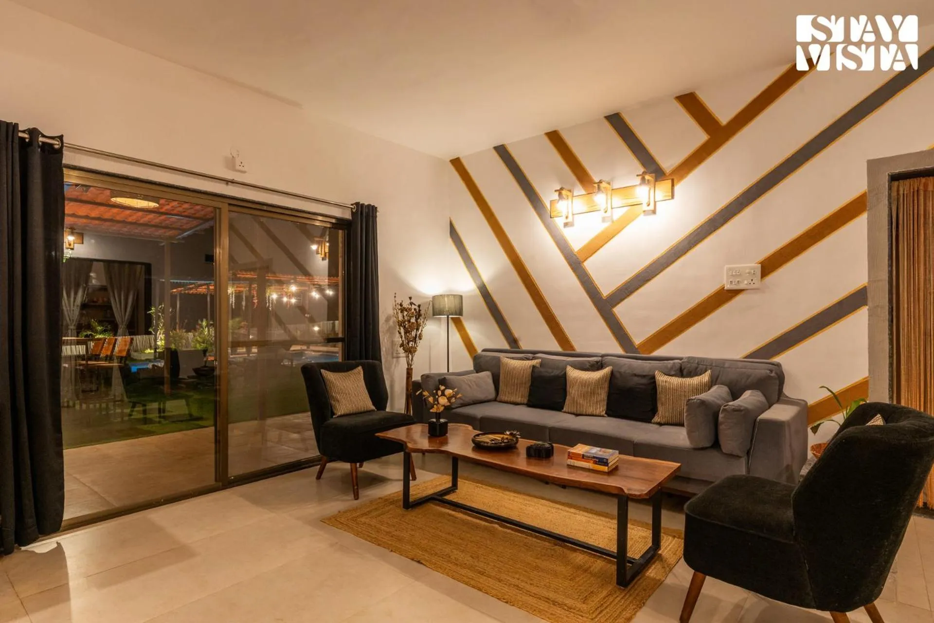 Living room in StayVista at Mangifera Agro Estate with Pool, Wi-Fi