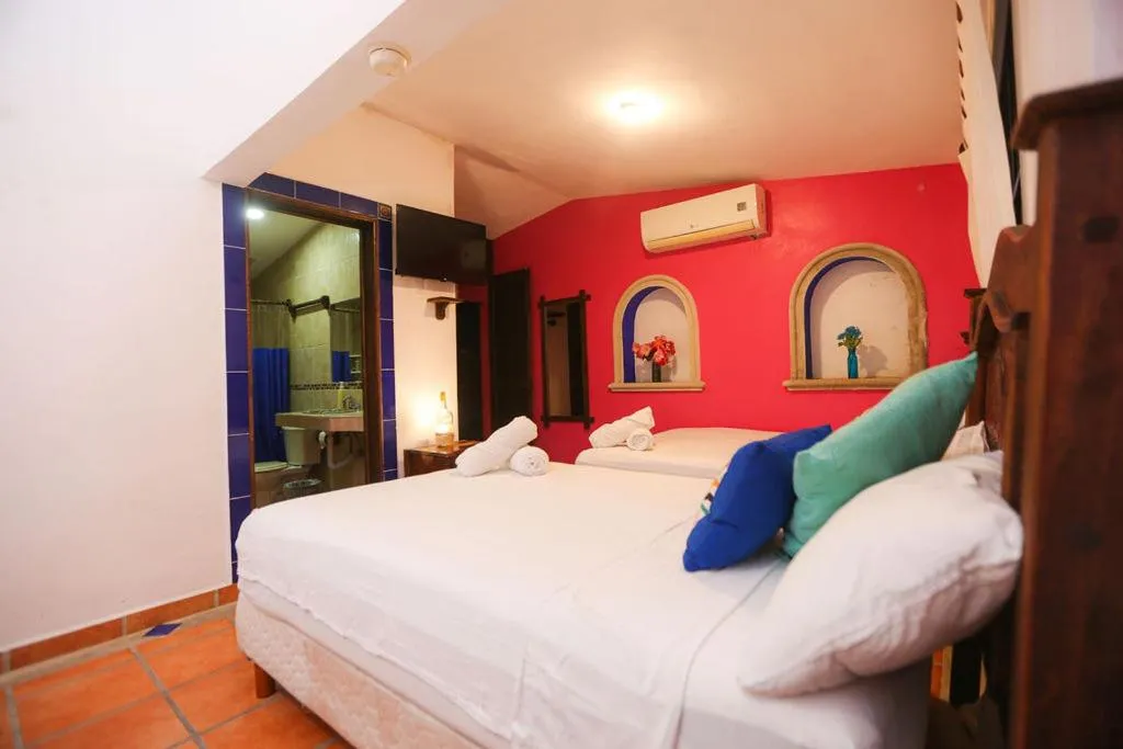 Bed in Íkaro Suites Colonial