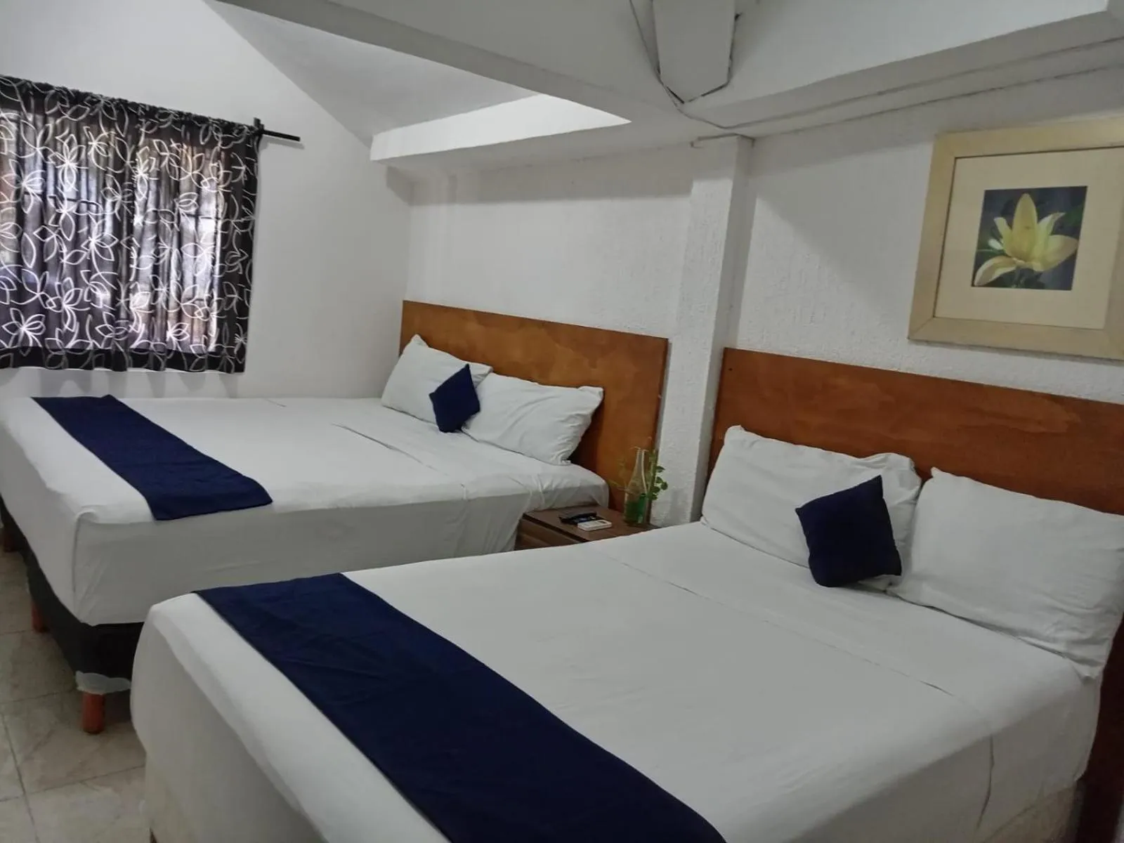 Bed in Íkaro Suites Cancún