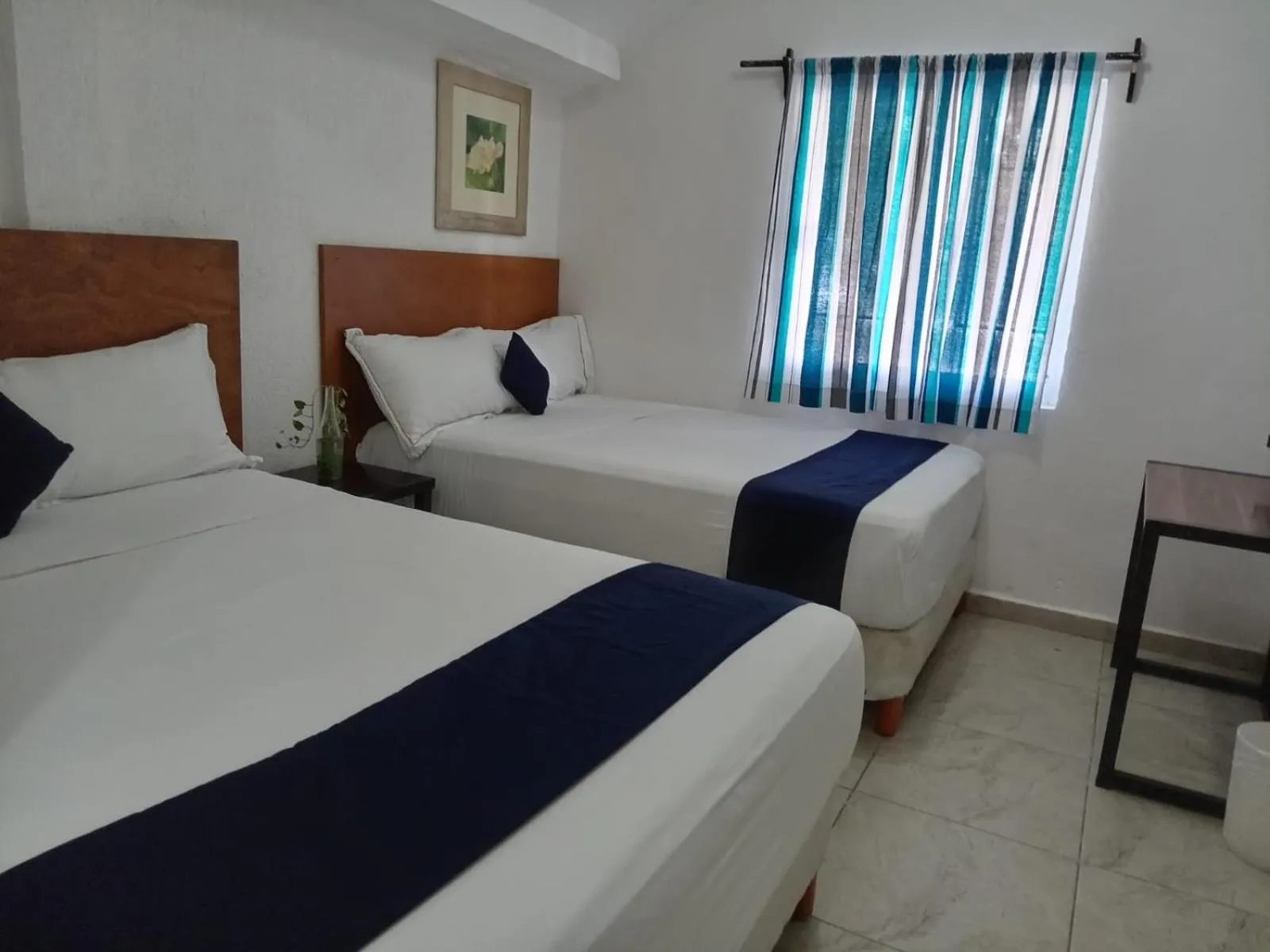 Bed in Íkaro Suites Cancún