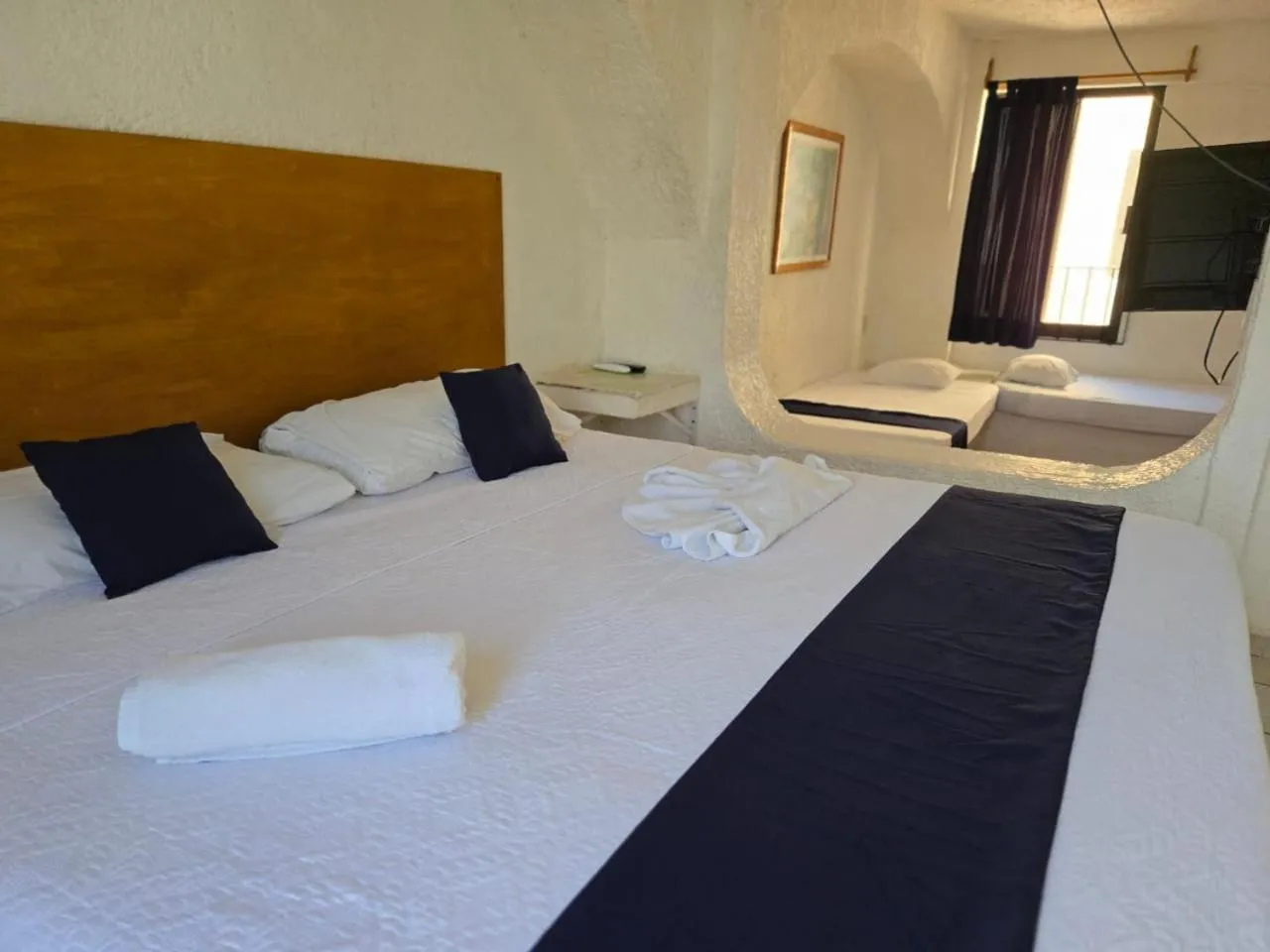 Bed in Íkaro Suites Cancún