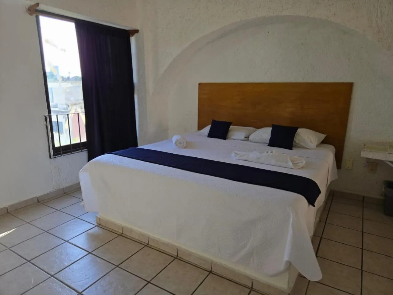 Bed in Íkaro Suites Cancún